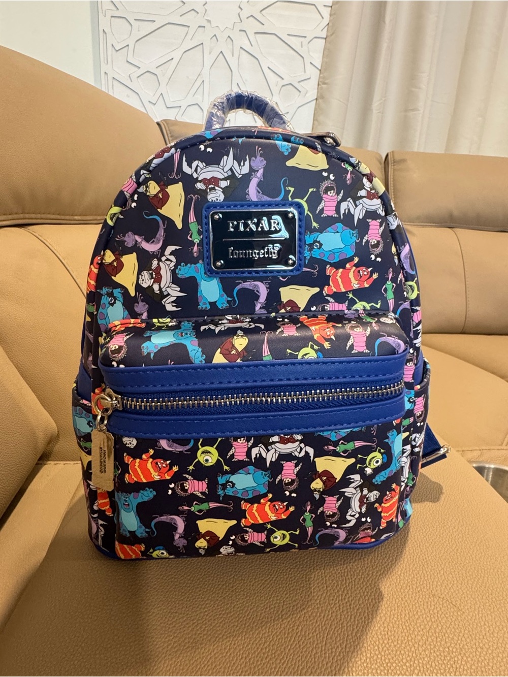 Loungefly Pixar Monsters Inc all over print Mini Backpack